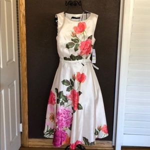 Cheats B ivory dress with flowers.